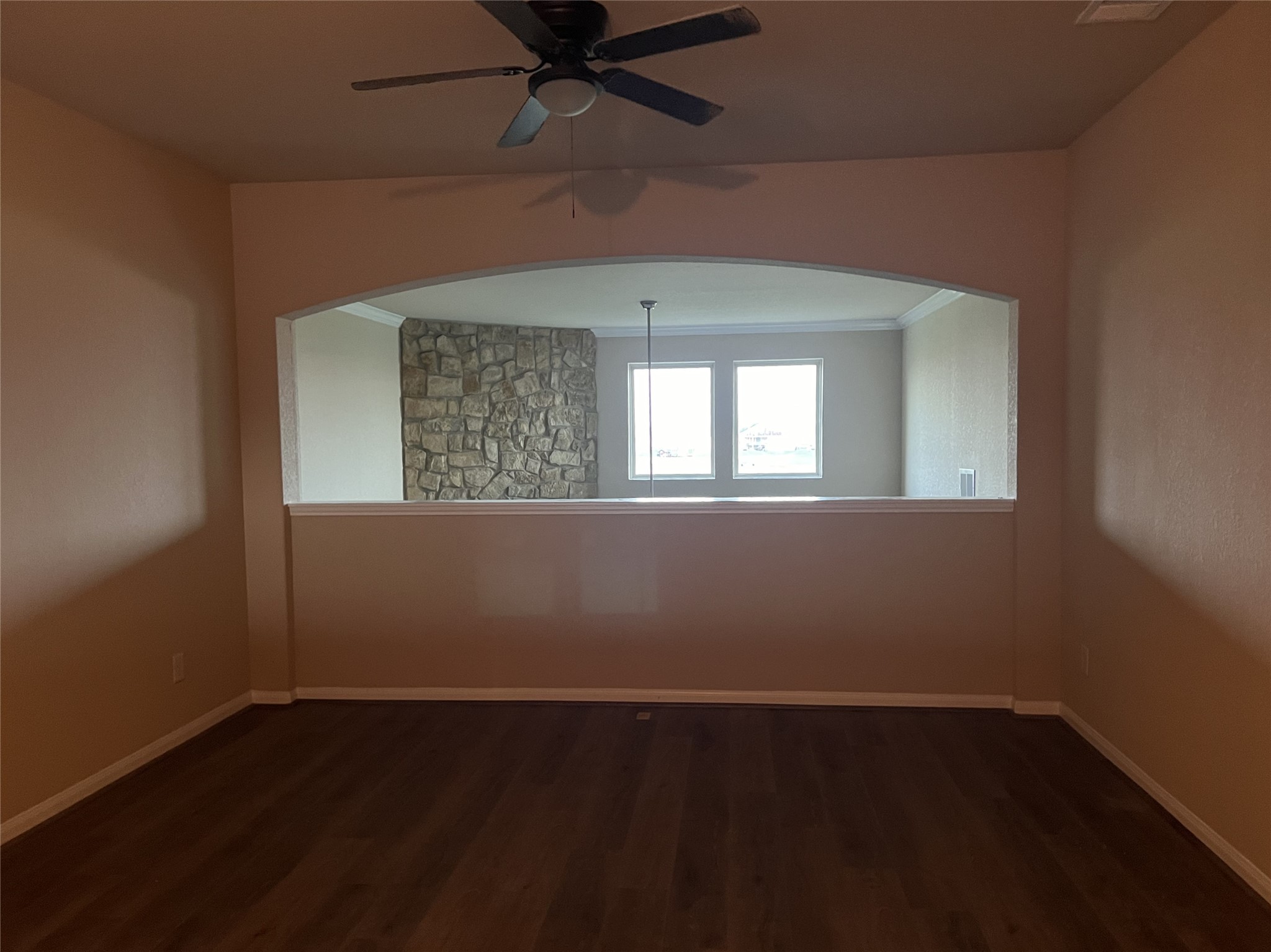 7703 Lehman Road Beasley, TX 77417 - Photo 12 of 17 an empty room with wooden floor and windows