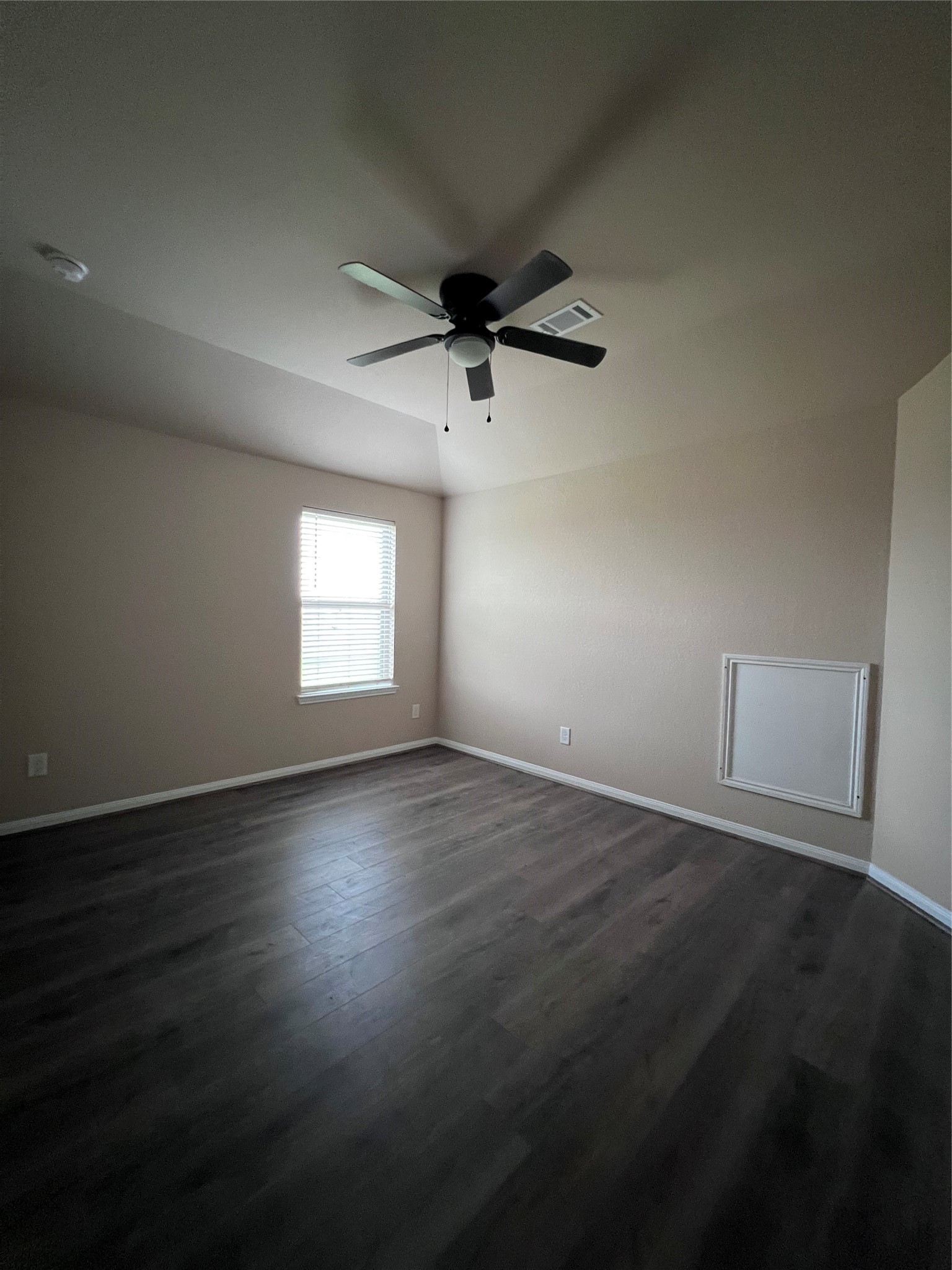 7703 Lehman Road Beasley, TX 77417 - Photo 14 of 17 an empty room with wooden floor and windows
