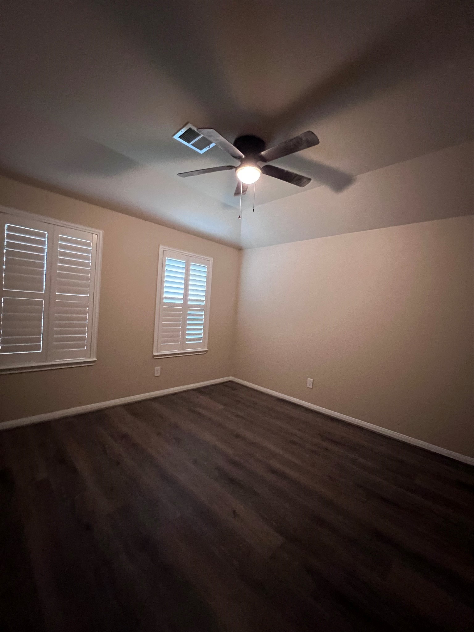 7703 Lehman Road Beasley, TX 77417 - Photo 15 of 17 a view of an empty room with wooden floor and a window