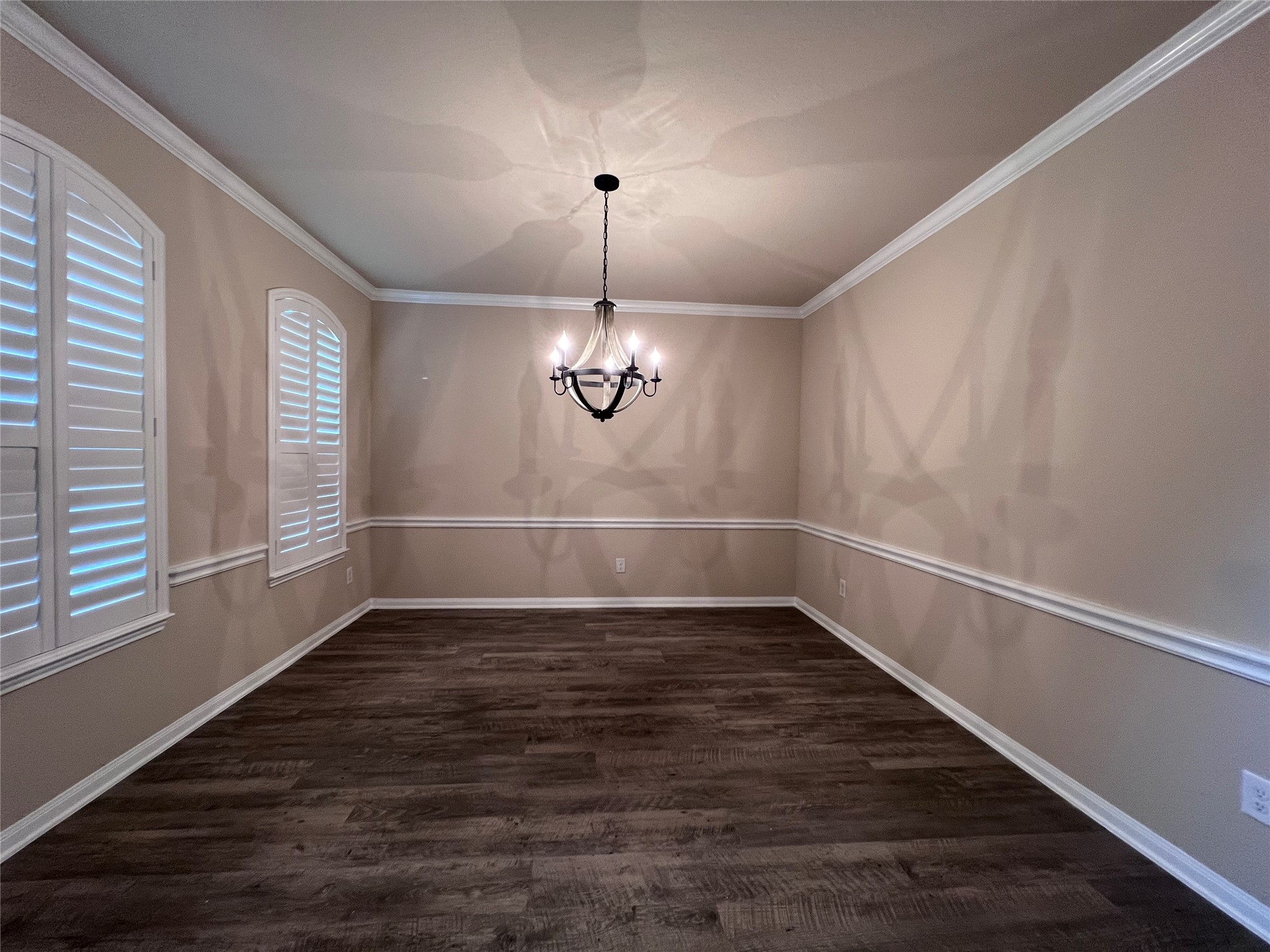 7703 Lehman Road Beasley, TX 77417 - Photo 4 of 17 an empty room with wooden floor chandelier and windows