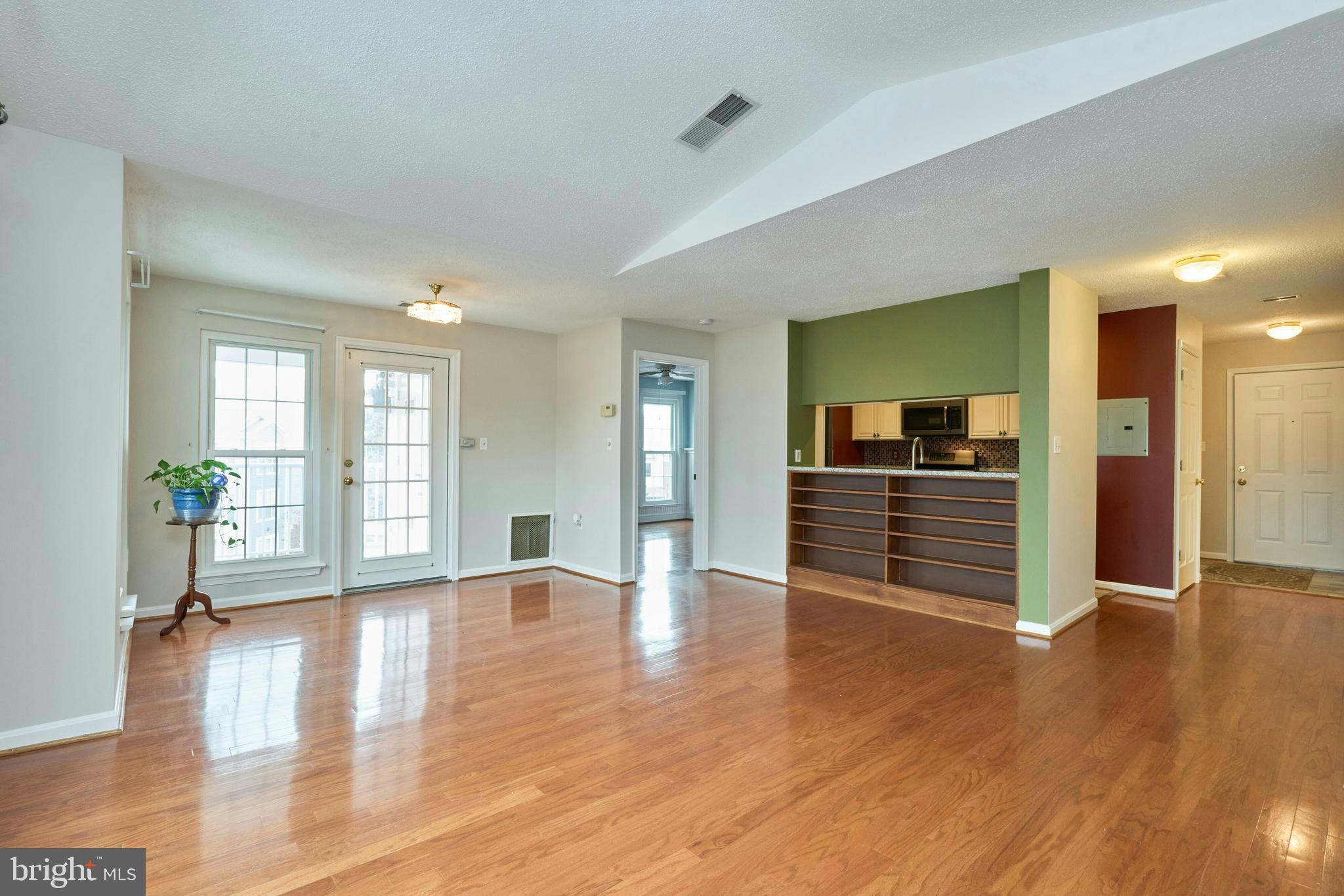 21014 Timber Ridge Terrace, Unit 302 Ashburn, VA 20147 - Photo 5 of 32 a view of a livingroom with wooden floor