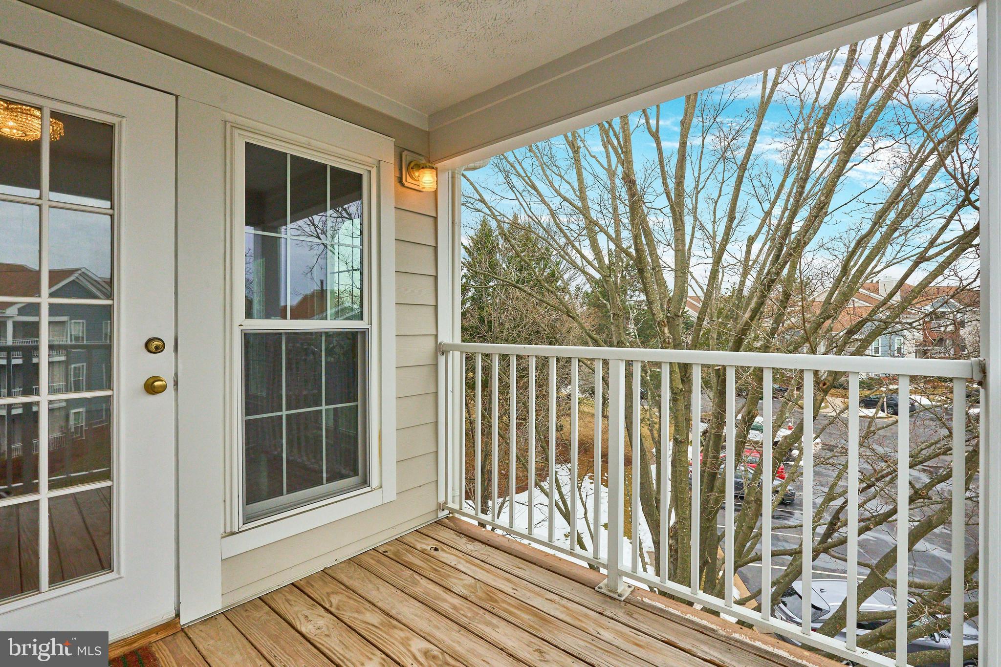 21014 Timber Ridge Terrace, Unit 302 Ashburn, VA 20147 - Photo 8 of 32 a view of wooden balcony