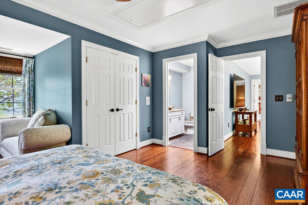 1059 Bryant Mountain Road Roseland, VA 22967 - Photo 29 of 58 a bedroom with a bed and wooden floor