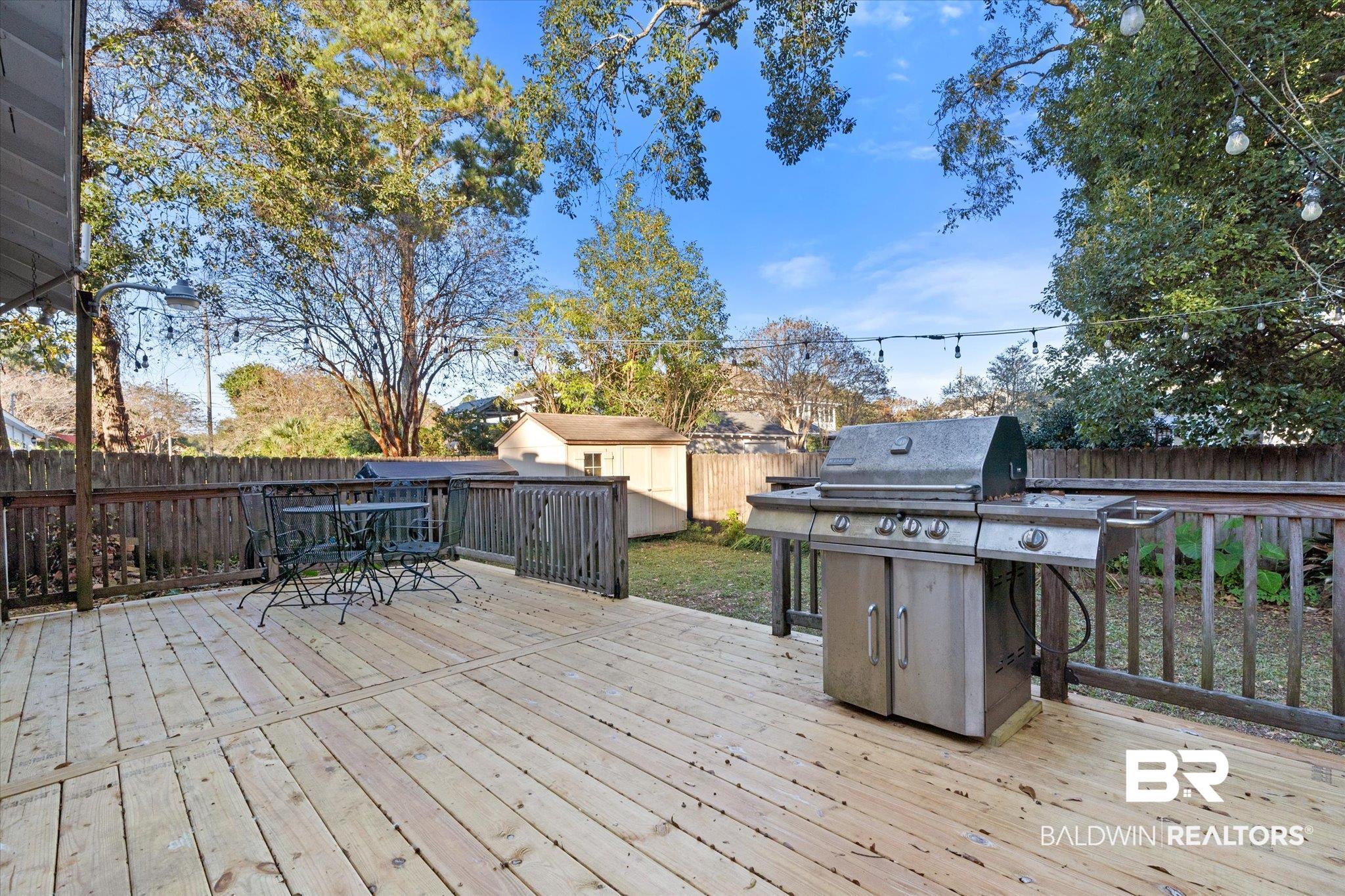 7 Rickarby Place Mobile, AL 36606 - Photo 17 of 20 Wooden deck with a storage unit