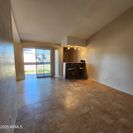 a view of kitchen with furniture and window