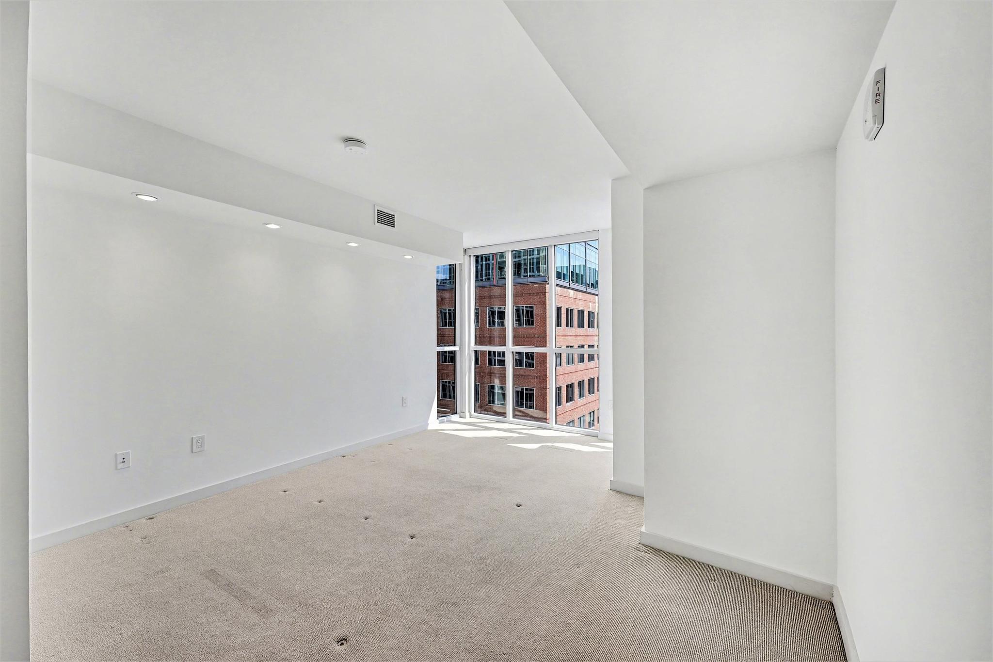 1025 First Street Southeast, Unit 906 Washington, DC 20003 - Photo 12 of 34 Primary bedroom w/ floor to ceiling windows