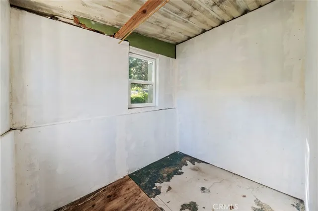 a kitchen with sink refrigerator and window