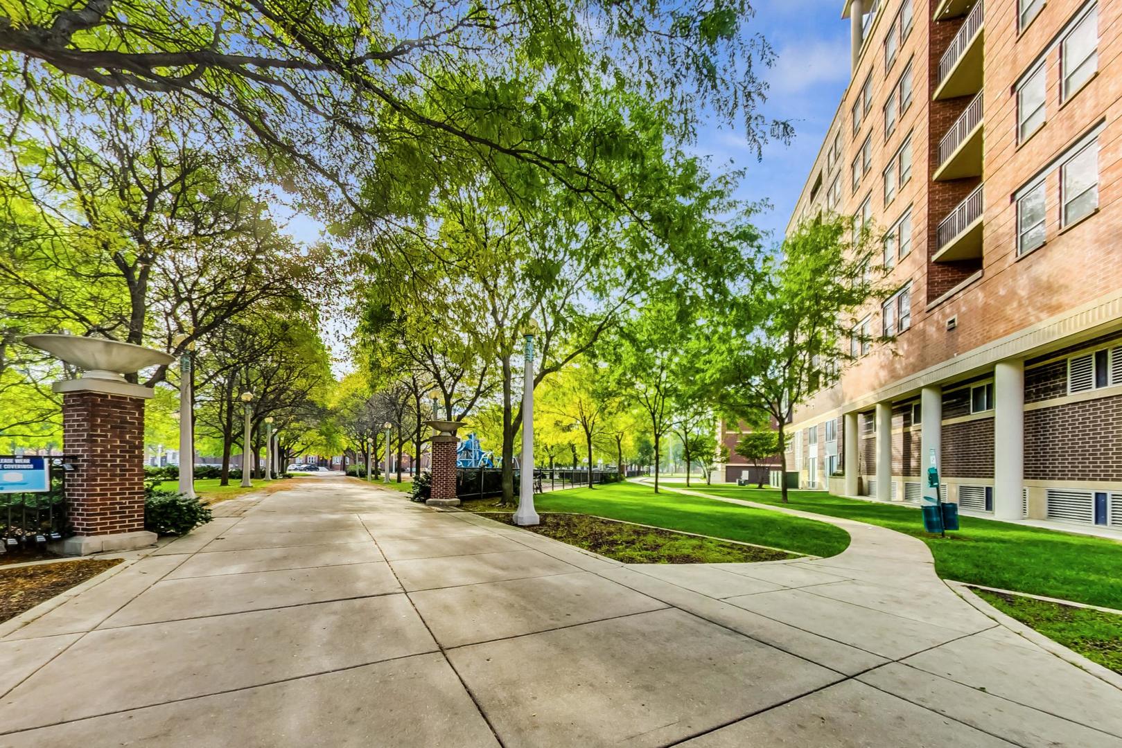 437 West Division Street, Unit 705 Chicago, IL 60610 - Photo 19 of 23 a view of a building with a yard