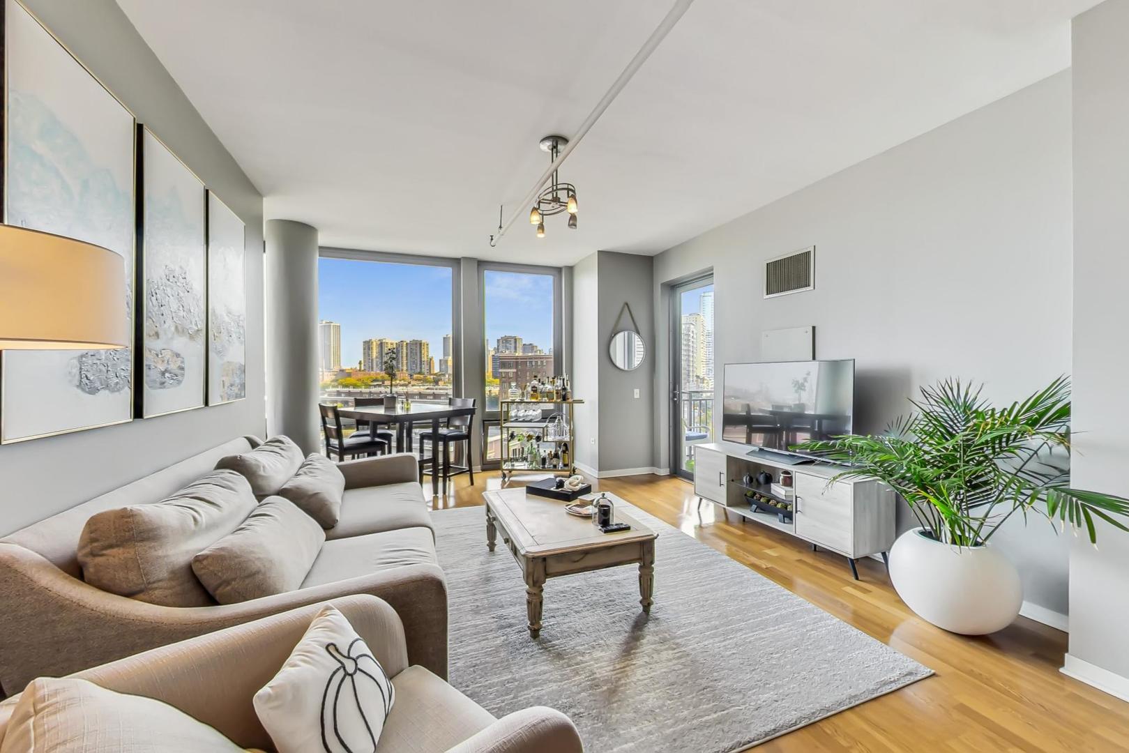 437 West Division Street, Unit 705 Chicago, IL 60610 - Photo 2 of 23 a living room with furniture potted plant and kitchen view