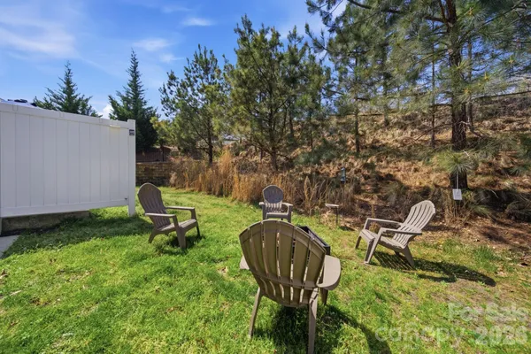 a view of a chairs in a backyard