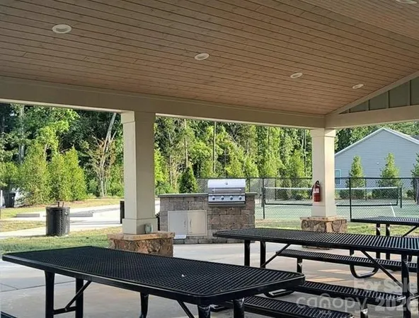 a outdoor dining space with furniture and outdoor view