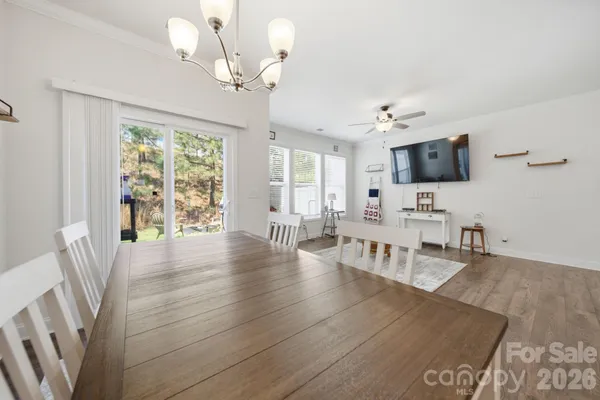 a living room with fireplace furniture and a flat screen tv