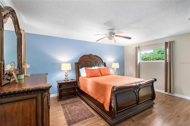 a bedroom with a bed and a dresser