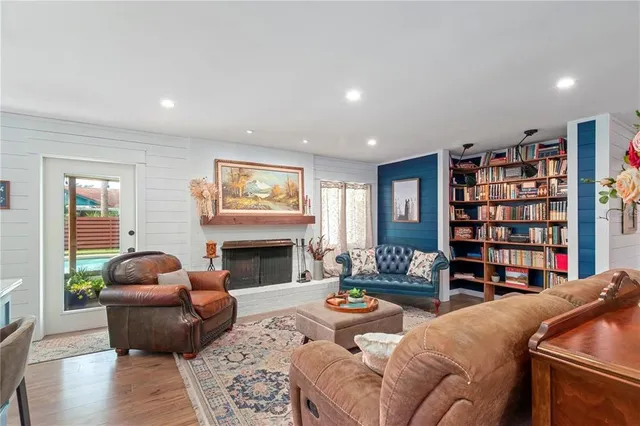 a living room with furniture and a fireplace