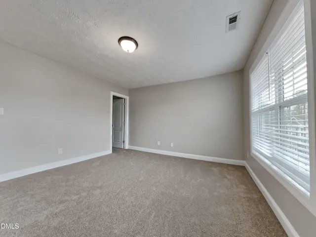 a white toilet sitting next to a bath tub