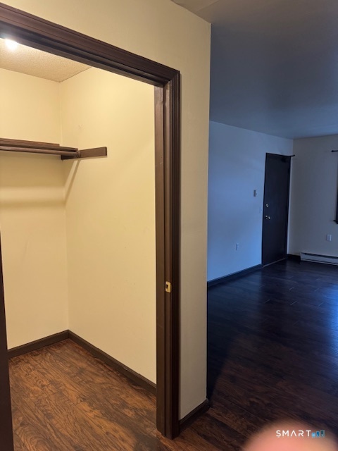 472 Cow Hill Road Groton, CT 06355 - Photo 8 of 11 a view of an empty room with wooden floor and a window