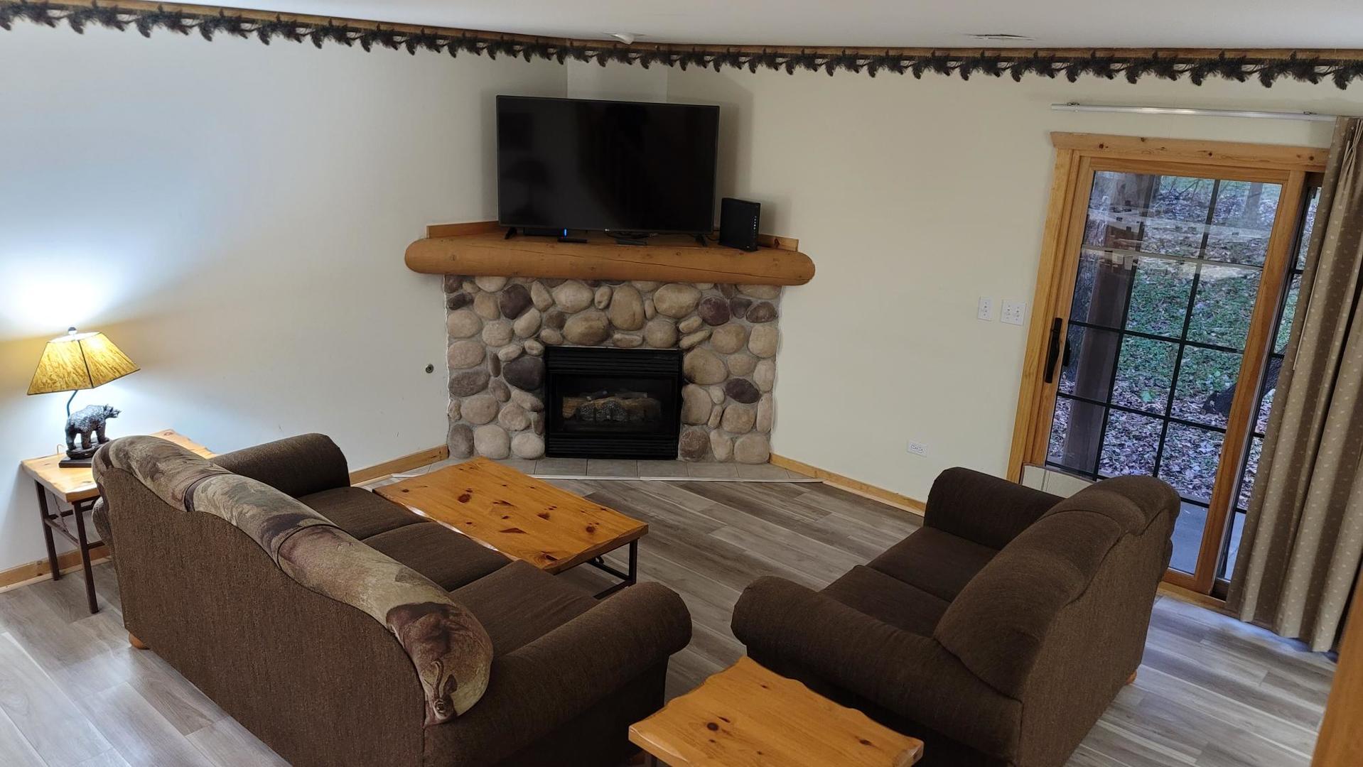 2643 North Il Route 178, Unit Q3 Utica, IL 61373 - Photo 4 of 10 a living room with furniture and a fireplace