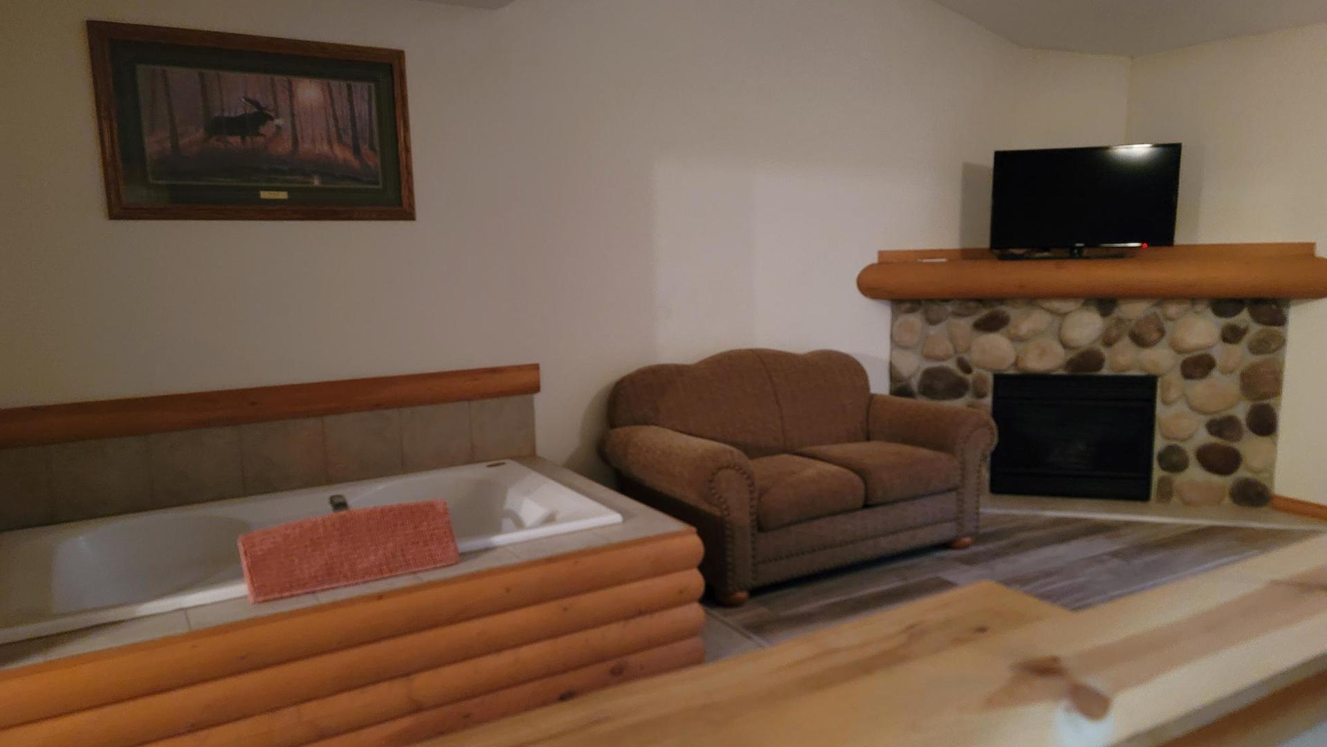 2643 North Il Route 178, Unit Q3 Utica, IL 61373 - Photo 7 of 10 a living room with furniture and a fireplace