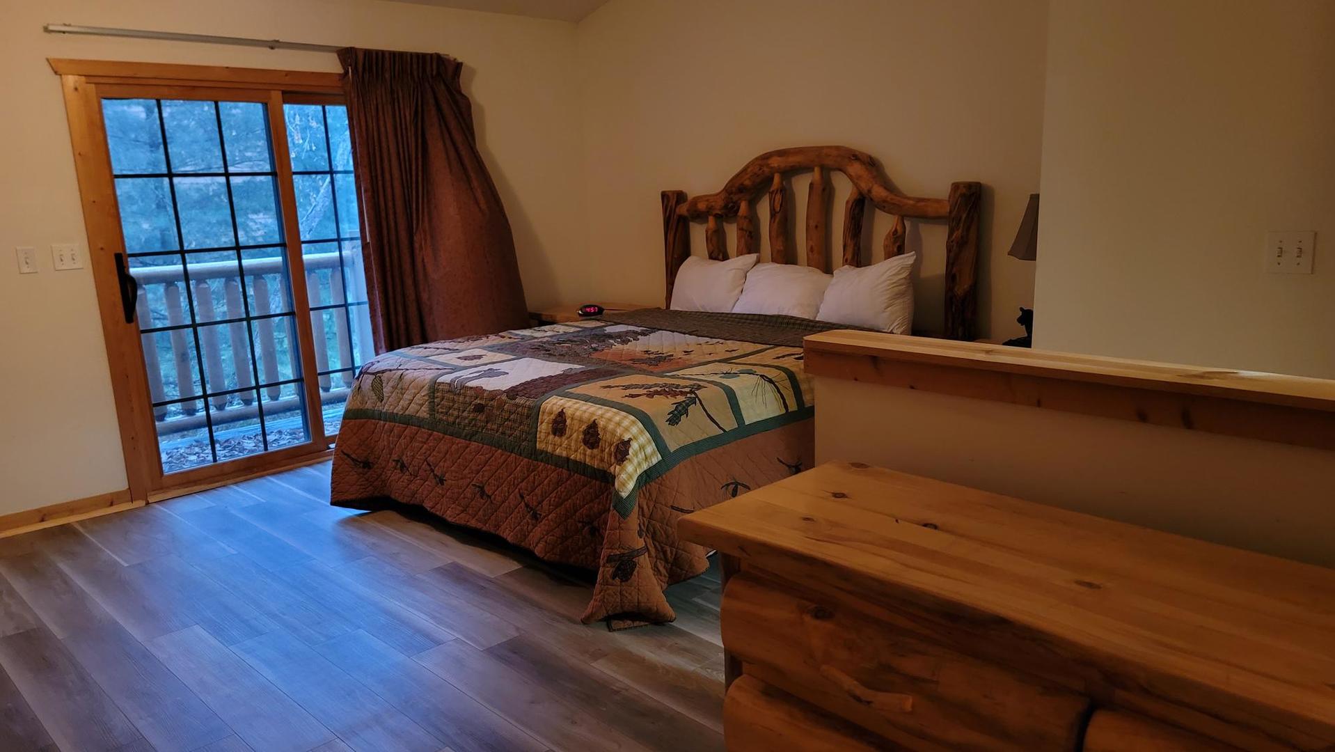 2643 North Il Route 178, Unit Q3 Utica, IL 61373 - Photo 8 of 10 a bedroom with a bed and a book shelf