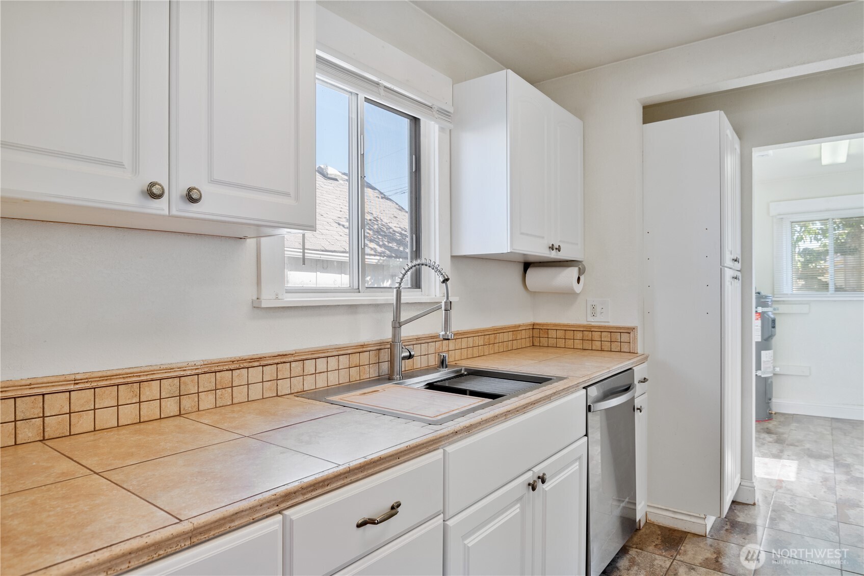 348 22nd Avenue Longview, WA 98632 - Photo 11 of 31 a kitchen with granite countertop white cabinets and a sink