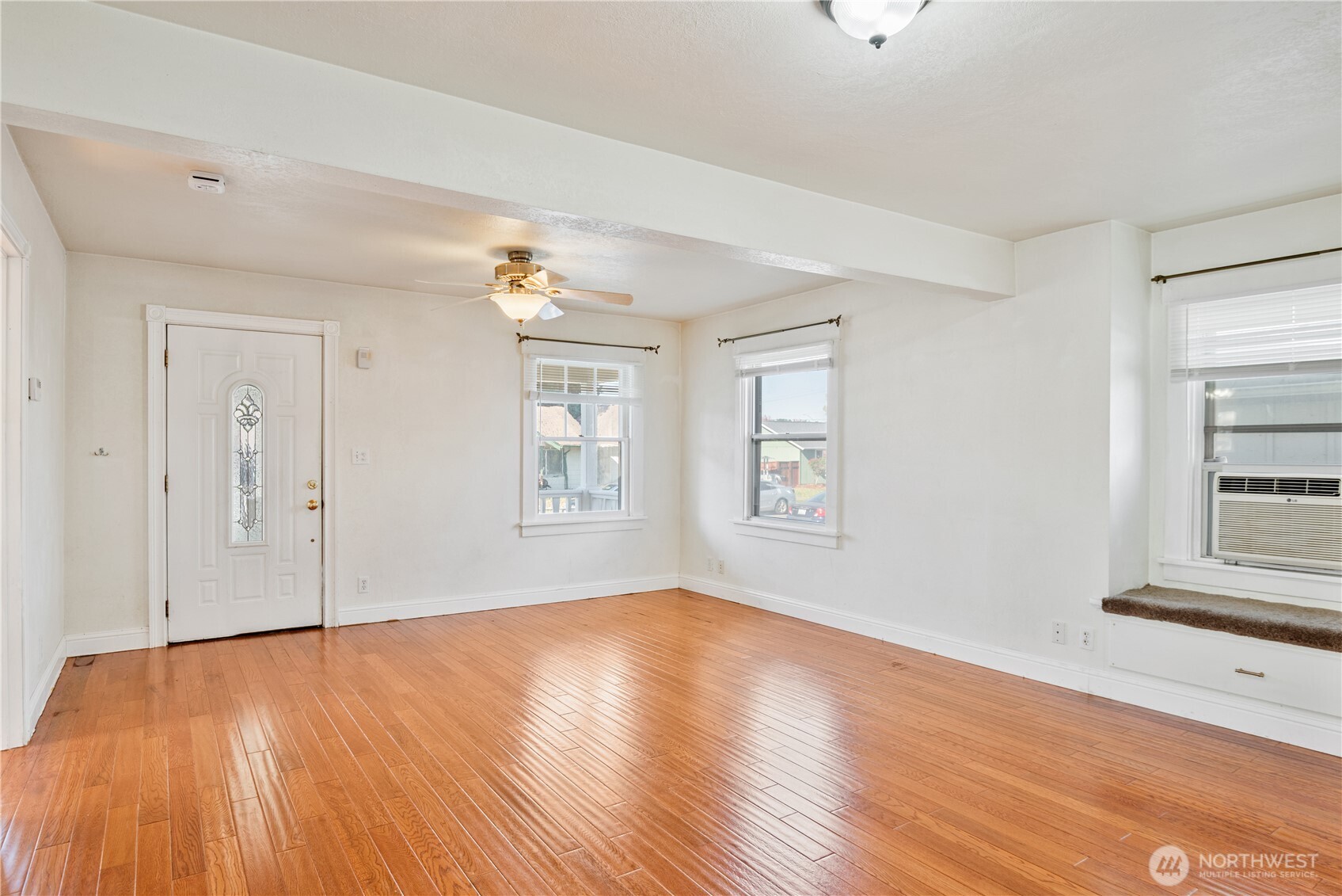 348 22nd Avenue Longview, WA 98632 - Photo 5 of 31 an empty room with wooden floor and windows