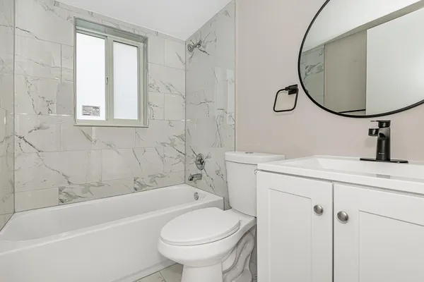 a bathroom with a sink a toilet and a bathtub