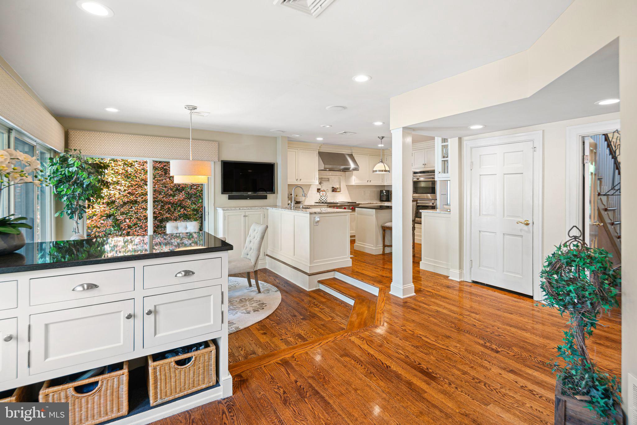 902 Warwick Road Haddonfield, NJ 08033 - Photo 12 of 43 a living room with stainless steel appliances kitchen island granite countertop a refrigerator and cabinets