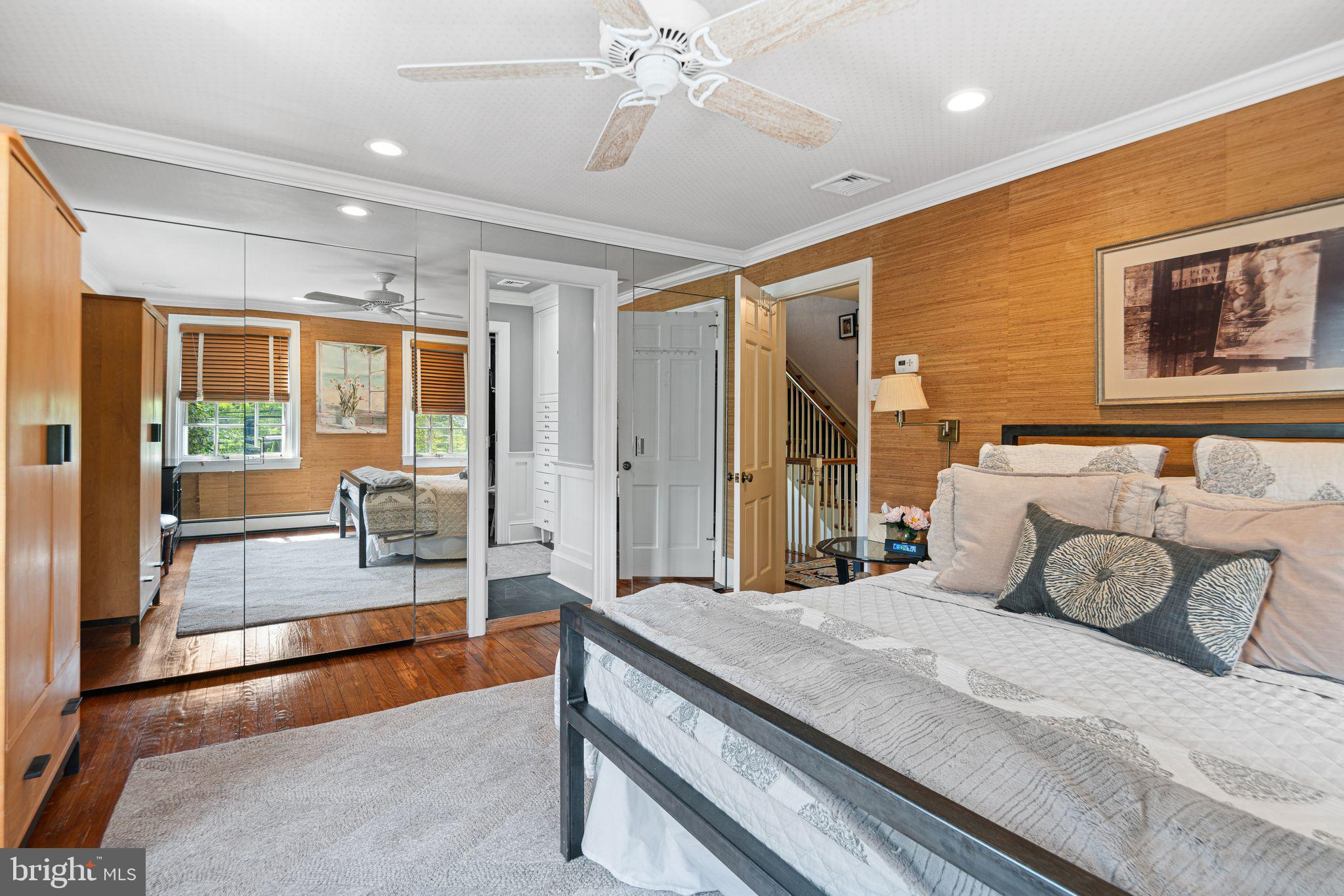 902 Warwick Road Haddonfield, NJ 08033 - Photo 18 of 43 a spacious bedroom with a large bed and a chandelier
