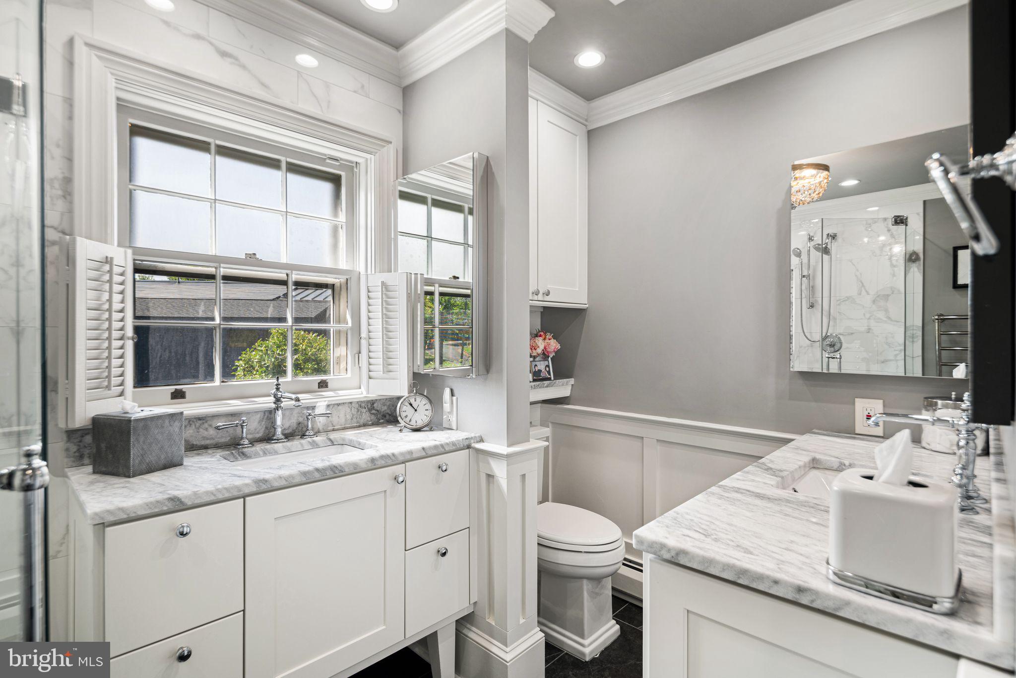 902 Warwick Road Haddonfield, NJ 08033 - Photo 20 of 43 a bathroom with a granite countertop sink mirror vanity bathtub and next to a window