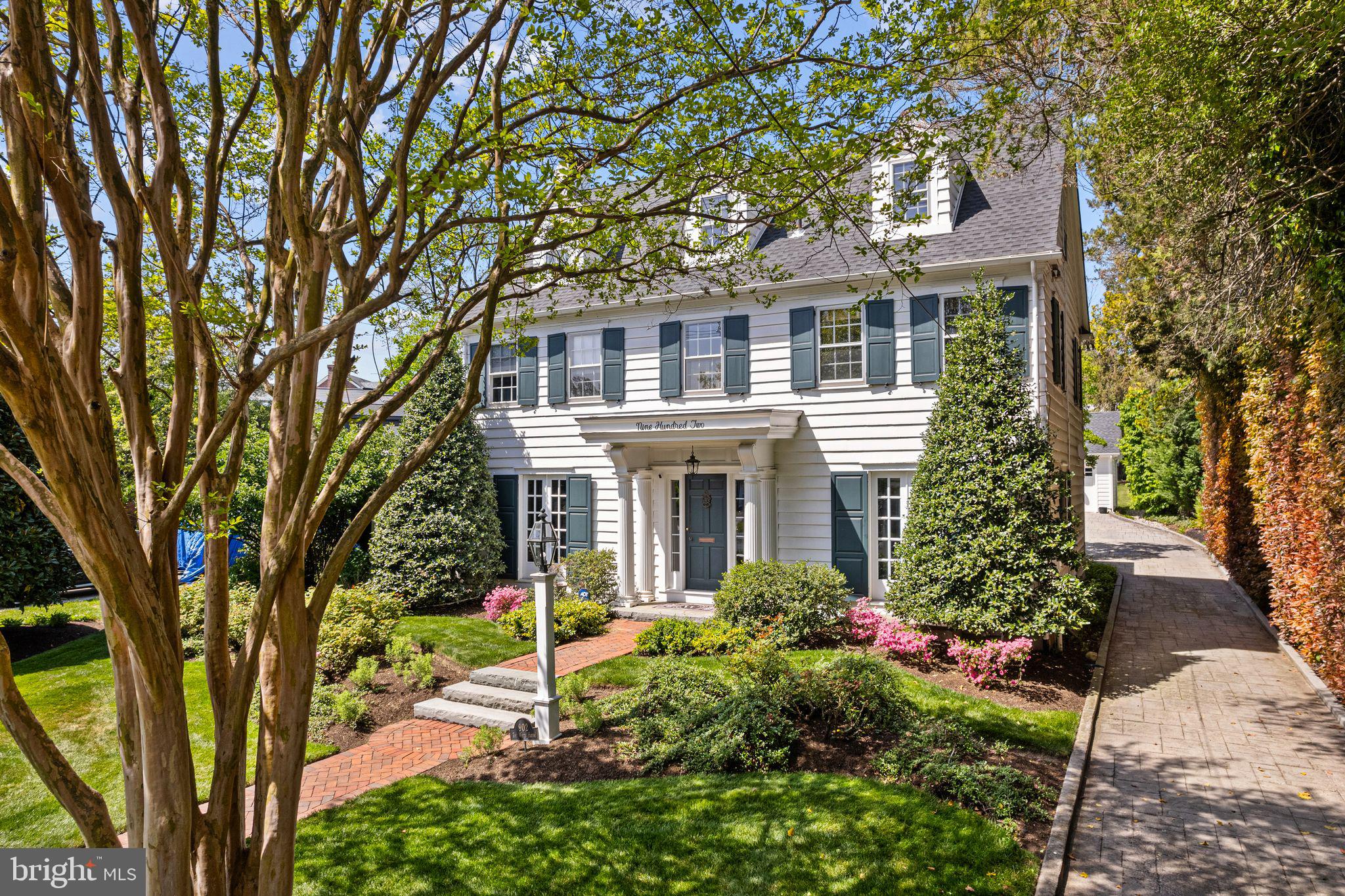 902 Warwick Road Haddonfield, NJ 08033 - Photo 2 of 43 a front view of a house with garden