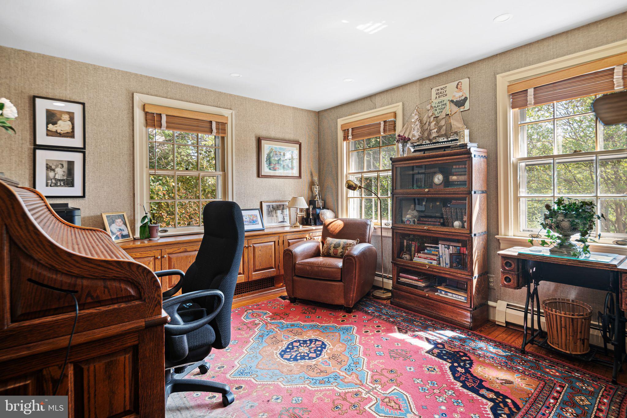 902 Warwick Road Haddonfield, NJ 08033 - Photo 22 of 43 a living room with furniture a flat screen tv and a window