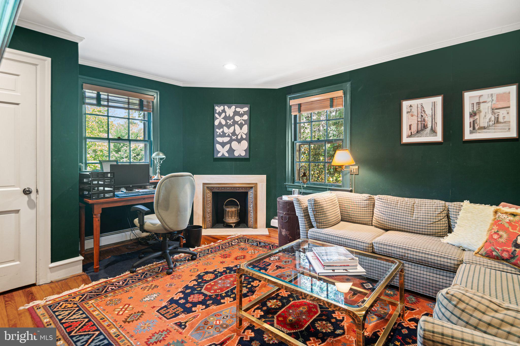902 Warwick Road Haddonfield, NJ 08033 - Photo 24 of 43 a living room with furniture a rug and a fireplace