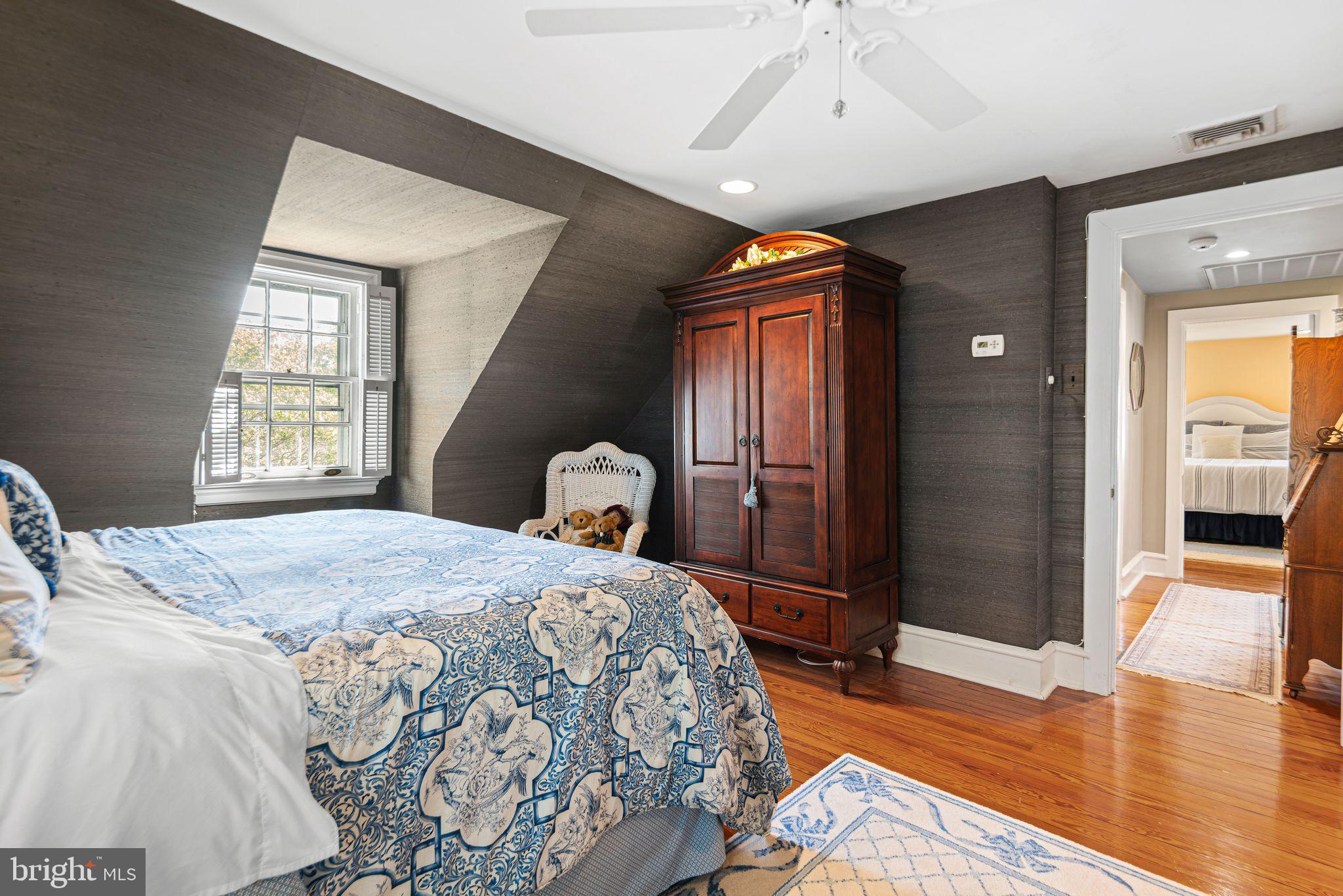 902 Warwick Road Haddonfield, NJ 08033 - Photo 28 of 43 a bedroom with a bed and wooden floor