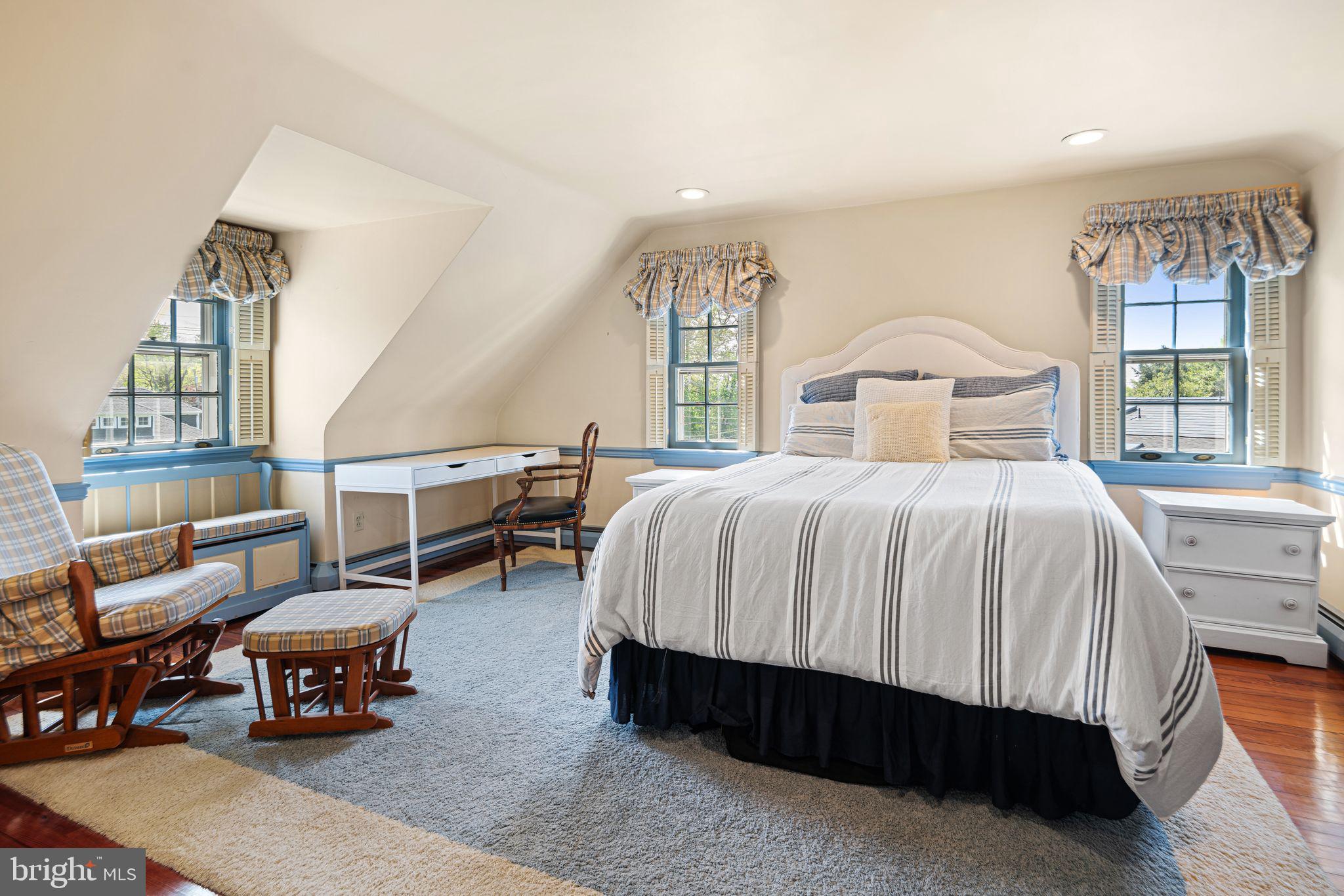 902 Warwick Road Haddonfield, NJ 08033 - Photo 29 of 43 a bedroom with a bed a table and large windows