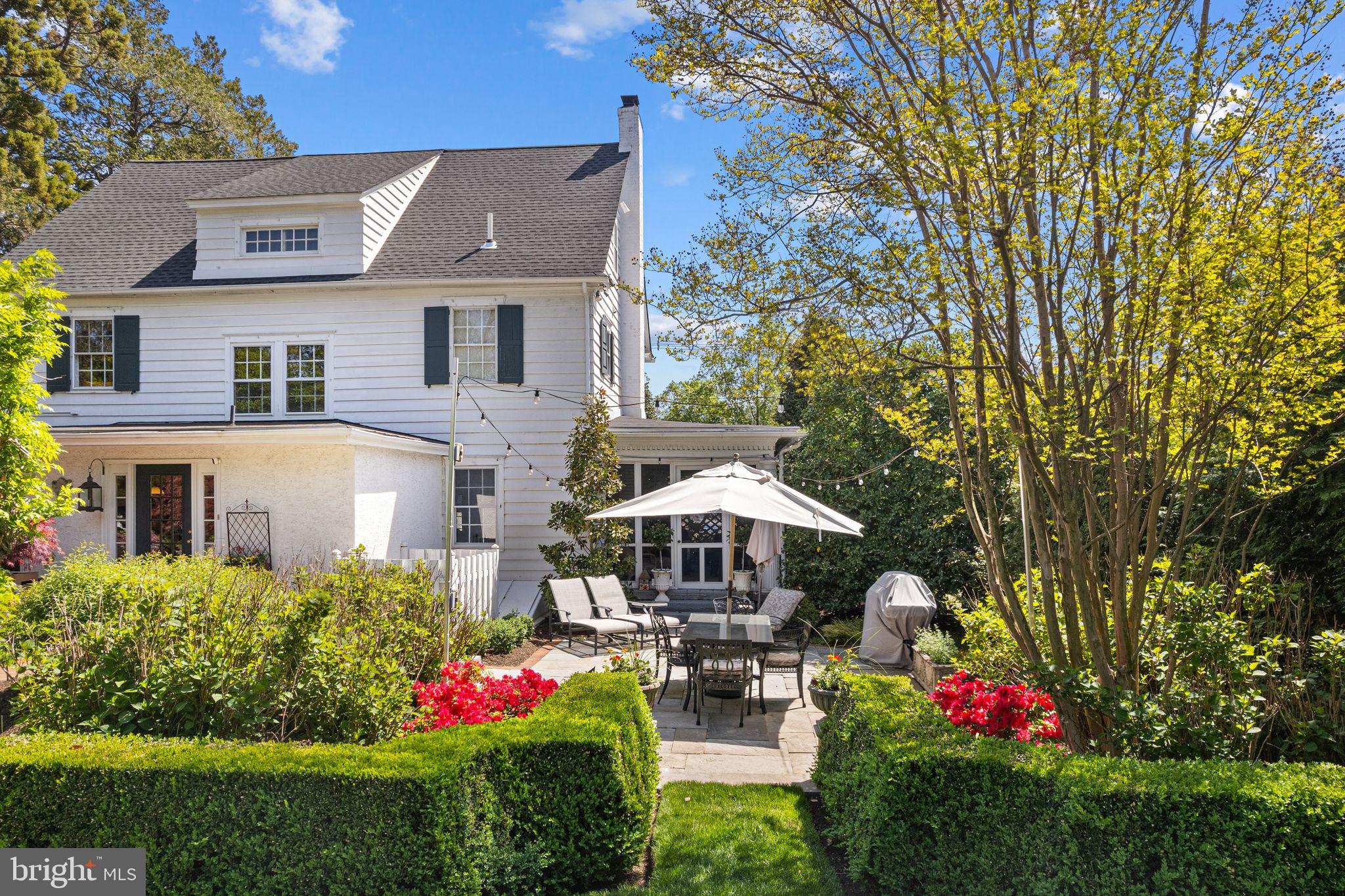 902 Warwick Road Haddonfield, NJ 08033 - Photo 37 of 43 a view of a house with table and chairs under an umbrella