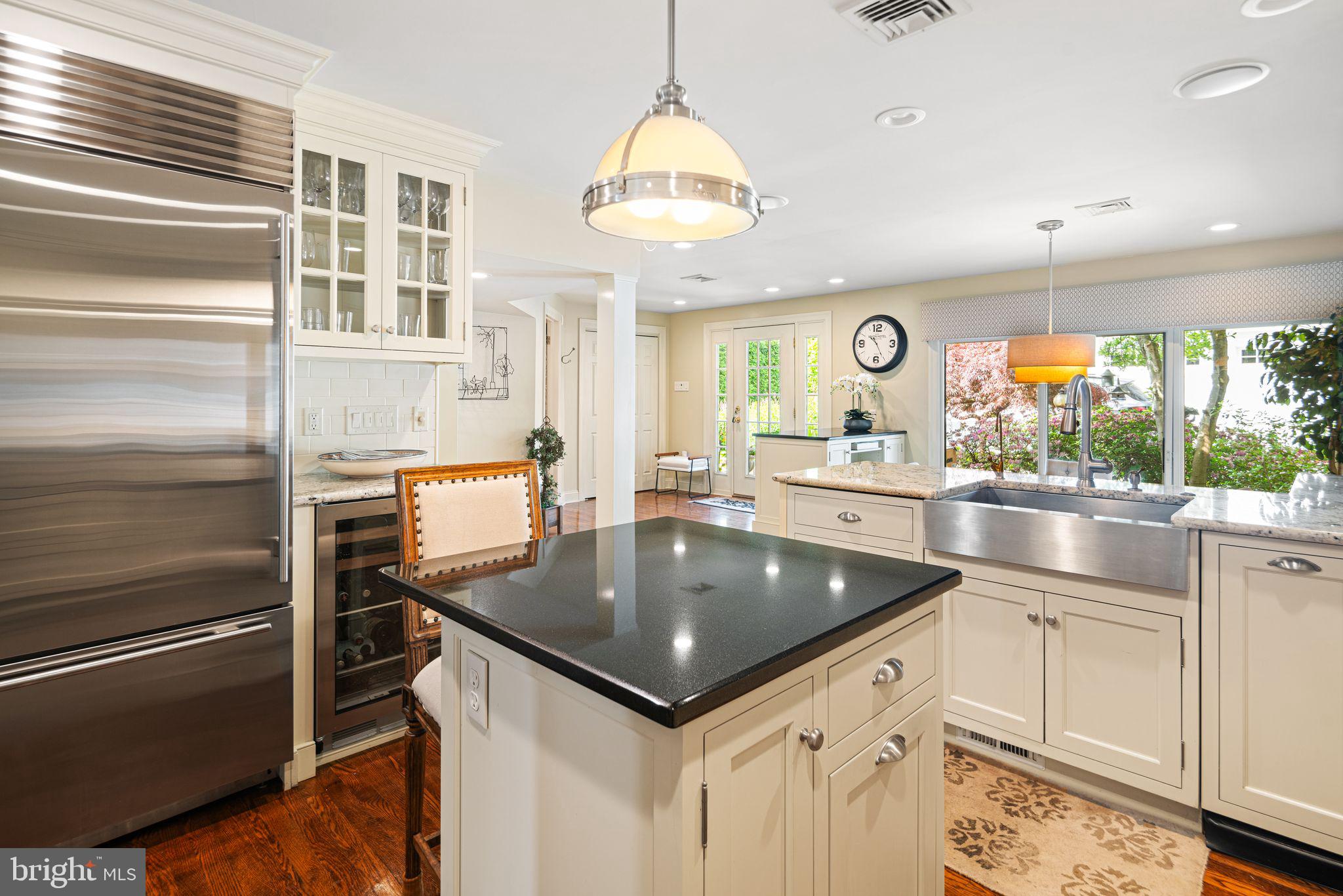 902 Warwick Road Haddonfield, NJ 08033 - Photo 10 of 43 a kitchen with a stove a refrigerator and a sink