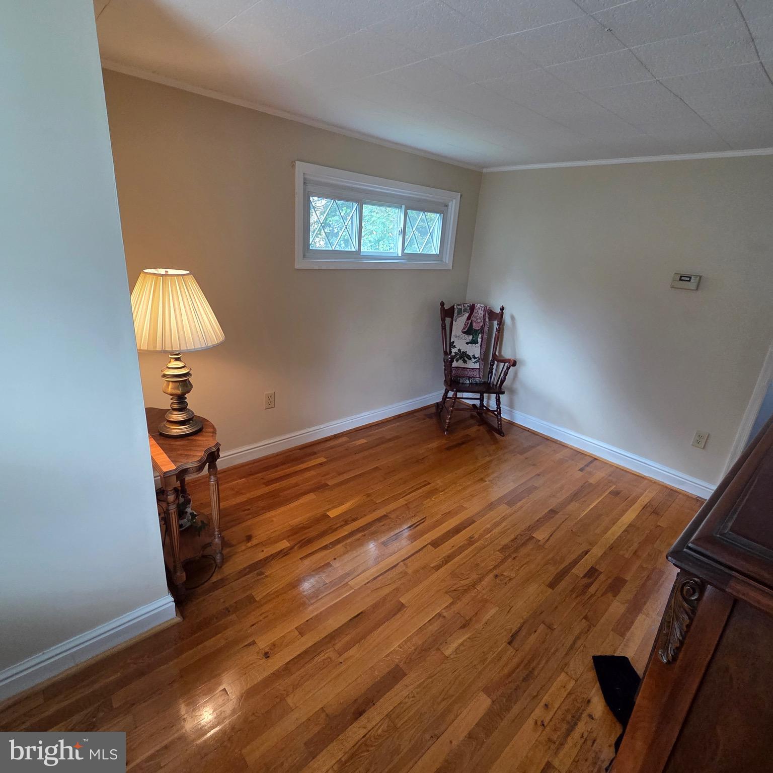 15919 Foundry Row Northwest Mount Savage, MD 21545 - Photo 19 of 41 a room with wooden floor and gym equipment