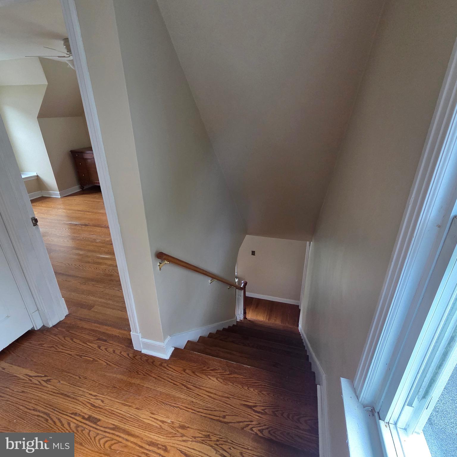 15919 Foundry Row Northwest Mount Savage, MD 21545 - Photo 20 of 41 a view of stairs and an empty room with wooden floor