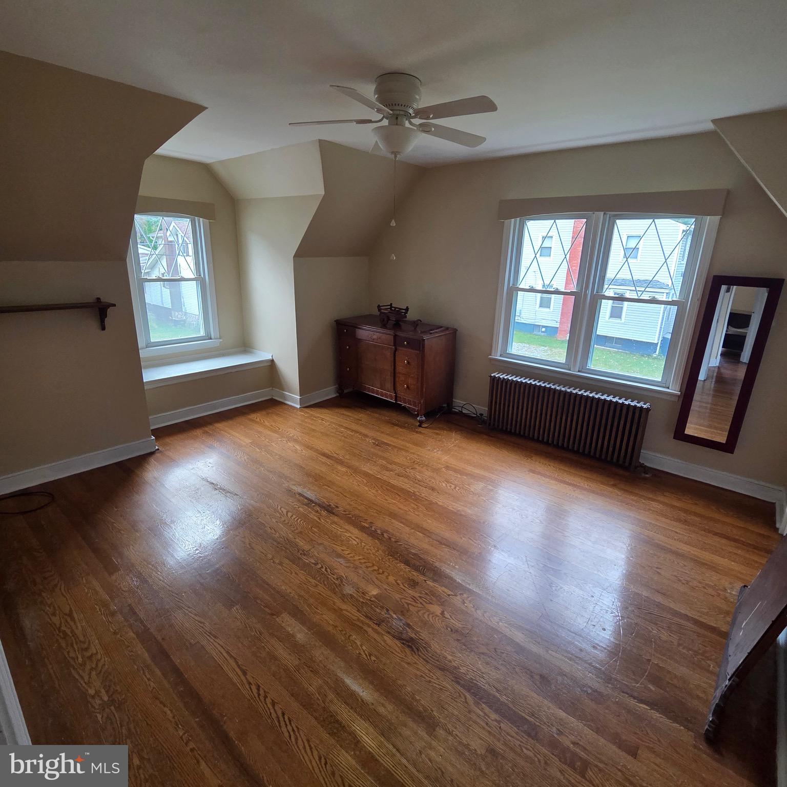 15919 Foundry Row Northwest Mount Savage, MD 21545 - Photo 21 of 41 an empty room with wooden floor and windows