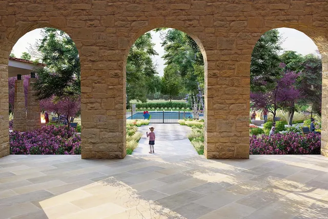 an aerial view of a house with swimming pool a patio and lake view