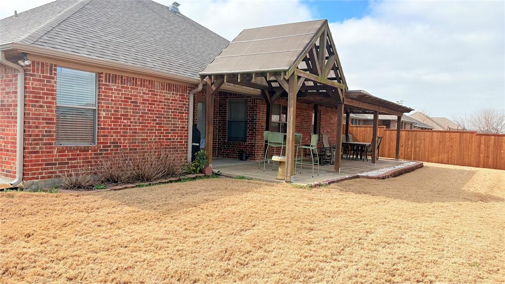 312 McAfee Street Mabank, TX 75147 - Photo 6 of 40 a view of a house with a patio