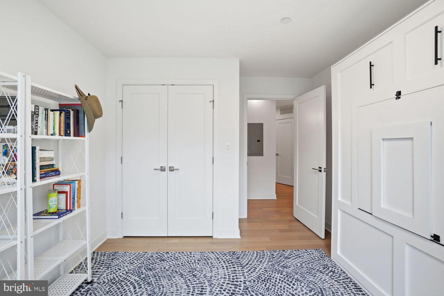 37 L Street Southeast, Unit 902 Washington, DC 20003 - Photo 20 of 43 a view of a hallway with closet and wooden floor