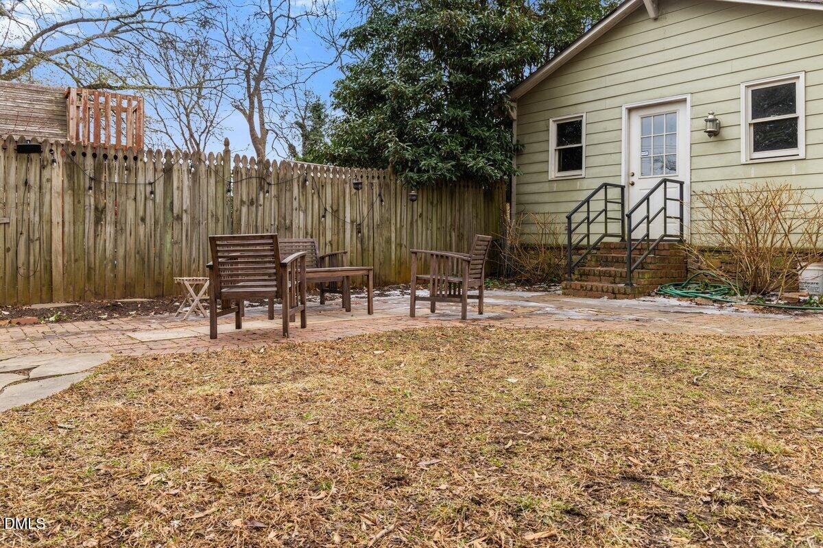 509 Cleveland Street Raleigh, NC 27605 - Photo 28 of 34 a backyard of a house with table and chairs