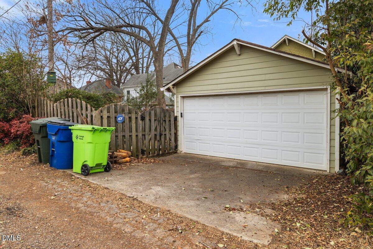 509 Cleveland Street Raleigh, NC 27605 - Photo 31 of 34 a view of a small house with a yard