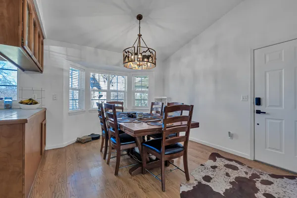 a kitchen with stainless steel appliances granite countertop a refrigerator and cabinets