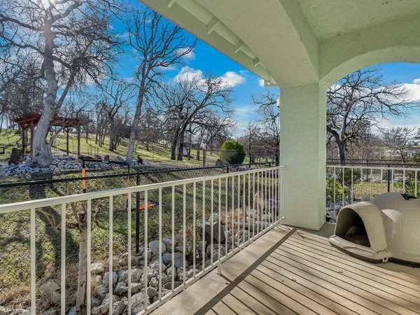 a view of balcony with furniture