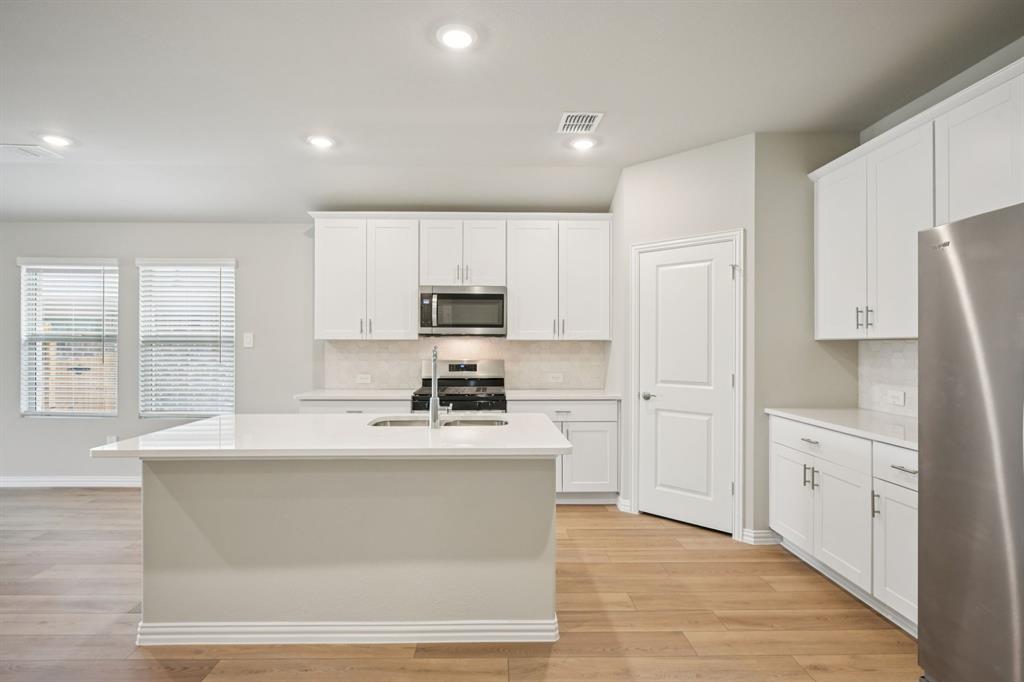 2105 Rannoch Street Sherman, TX 75092 - Photo 5 of 26 Photo is not of the actual home, but is an inspirational photo of builder’s model home and may depict options, furnishings, and/or decorator features that are not included.