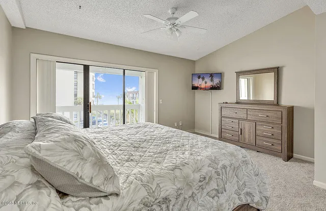 a bedroom with a bed and a table