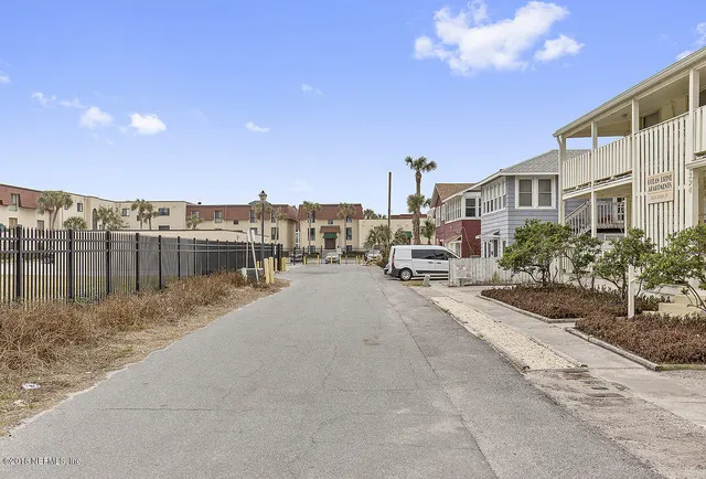 a view of multiple house with a yard