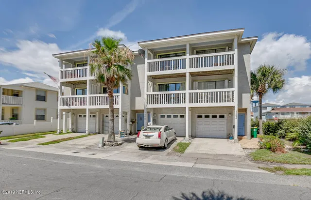 a swimming pool with outdoor seating and yard